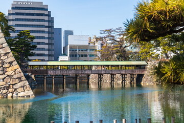 View with a covered bridge over the moat , Takamatsu city, kagawa, shikoku, japan	