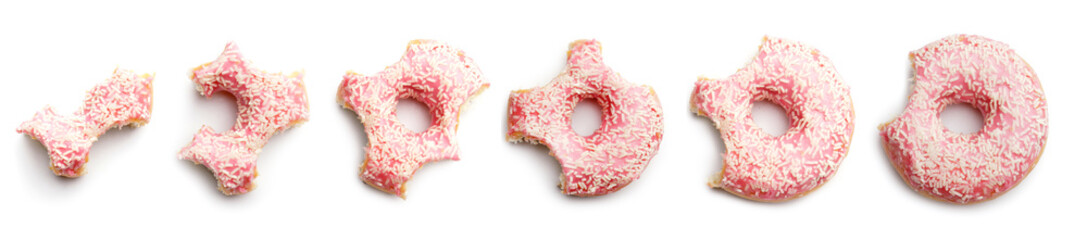 Process of eating tasty donut on white background
