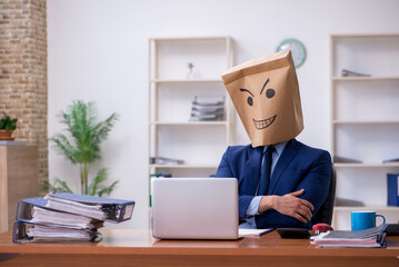 Young male employee with box instead of his head