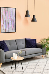 Stylish sofa in interior of modern living room