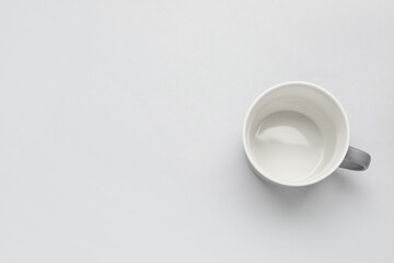 Empty cup on light background