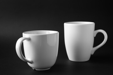 Empty cups on dark background