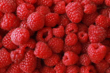 Sweet red raspberries as a background