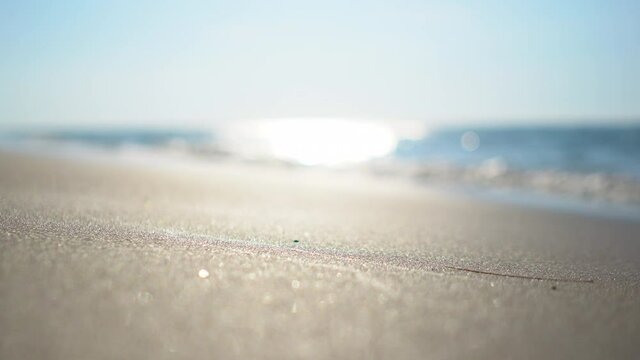 4k of blur tropical beach with summer blue sky bokeh background.