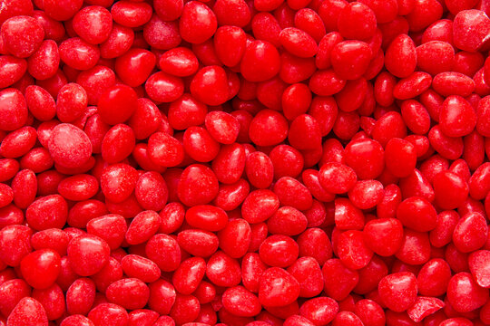 Bright Red Cinnamon Heart Texture; many cinnamon hearts in a pile