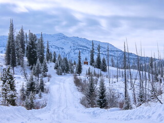 wooden church in winter in mountains kazakhstan