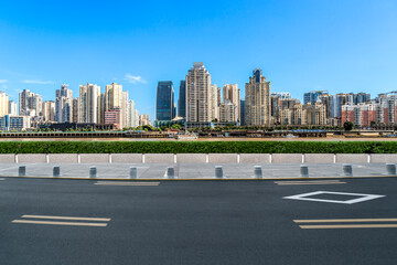 Asphalt highway and urban buildings