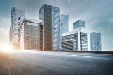 Asphalt highway and urban buildings