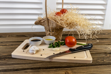 Tomatoes on the table and in the basket, olive oil and balsamic vinegar, garlic, vegetables, vegetarianism, healthy eating