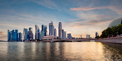 Singapore business district skyline during sunset. Group of skyscrapers at Marina Bay, Singapore.