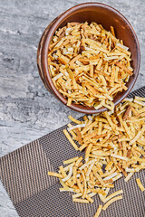Bowl of crackers on marble background
