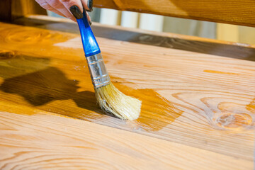 Cover the board with oil. Paint with a brush. Carpentry work. Impregnate wood.