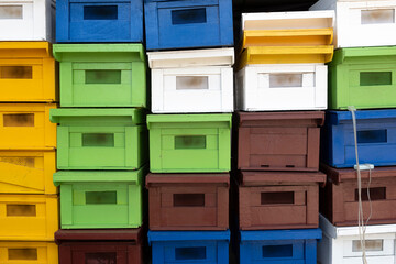 Stacked of colorful new bee houses