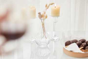 Fototapeta na wymiar Coffee, candles and marshmallow in chocolate