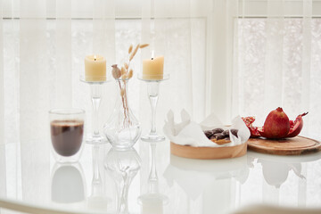 Morning concept with coffee, marshmallow in chocolate and pomegranate