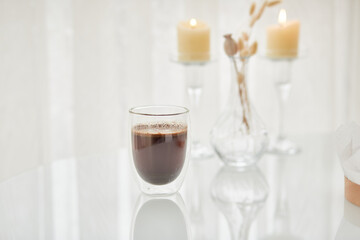 Morning coffee with candles on the white background