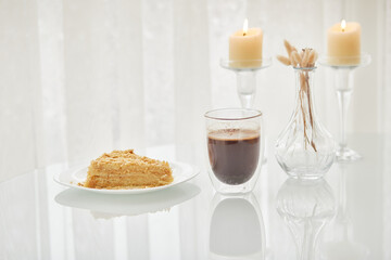 Piece of cake, coffee and candles