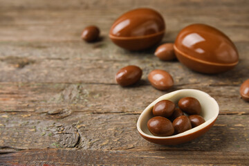 Chocolate Easter eggs on wooden background