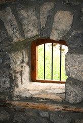 window in the old  stone wall