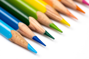 Colored pencils background. Color pencils on white background.