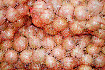 Bulb onions in bags. Onion Sets.