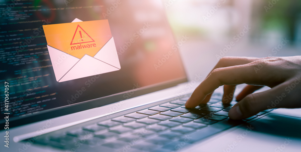 Poster concept of cyber crime, hand using laptop and show malware screen that comes with email, hack passwo