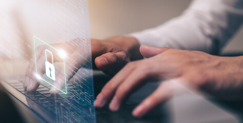 Technology concept with cyber security internet and networking, Businessman hand working on laptop, screen padlock icon on digital display.