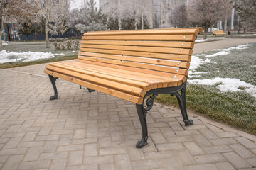 Wooden bench in the city park.