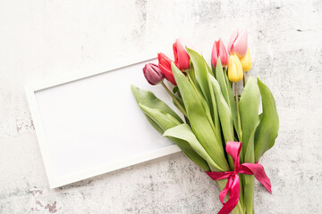 colorfull tulip bouquet and blank frame for mock up design on white background