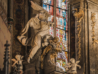 LVIV, UKRAINE - FEBRUARY 13, 2021: Interior of The Archcathedral Basilica of the Assumption of the Blessed Virgin Mary or the Latin Cathedral. Statue of angel.