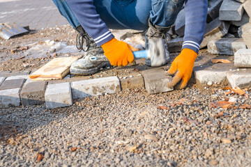 Replacing old paving slabs in the city.