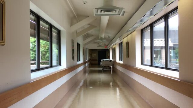 Bright hospital corridor view with no people