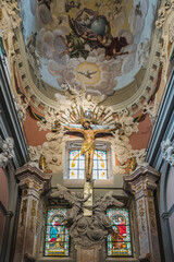 Fototapeta na wymiar LVIV, UKRAINE - FEBRUARY 13, 2021: Interior of the Latin Cathedral. Chapel to Jesus Crucifixion, also called as the Jablonowki family chapel. The gothic crucifix is placed into the Baroque altar.