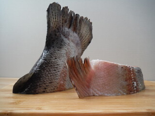 fresh salmon fillet on a board, food closeup.