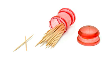 Wooden toothpicks in a case isolated on a white background.