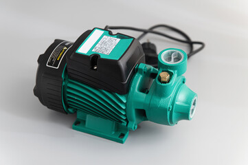 Vortex self-priming pump, top-side view, on a light gray background