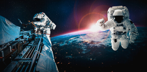 Astronaut spaceman do spacewalk while working for space station in outer space . Astronaut wear full spacesuit for space operation . Elements of this image furnished by NASA space astronaut photos. © InfiniteFlow