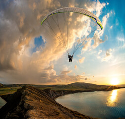 paraglider pilot fly in sky on beauty nature mountain and sea landscape