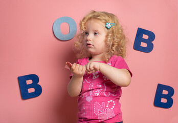 Little girl  2-3 year during lesson with his speech therapist