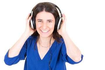 cute pretty woman listening to music in headphones on white background