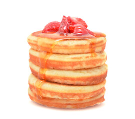 American pancakes with liquid honey, fresh ripe strawberris in stack isolated on white
