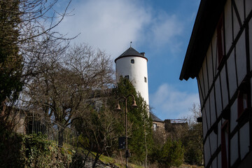 An old German half-timbered house and the view of Kreuzberg Castle