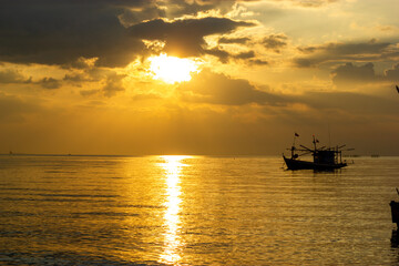 Fototapeta na wymiar boat at sunset,Fishing boats at sunset, Bang Lamung, Chon Buri, Thailand