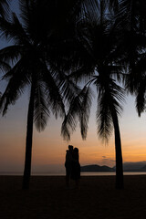 The image of two people in love at sunset. Sunrise
