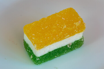Multi colored layered marmalade. Closeup of wonderful dessert.