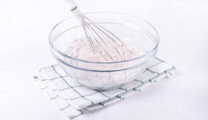 Rye and wheat flour are mixed in the glass bowl with whisk. Dry ingredients. Step by step recipe of...