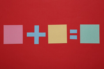 Equation with blank pieces of paper on a red background