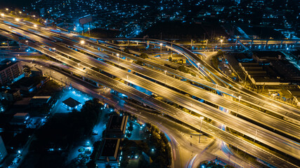Fototapeta na wymiar Expressway top view, Road traffic an important infrastructure in Thailand. Road and Roundabout, multilevel junction motorway
