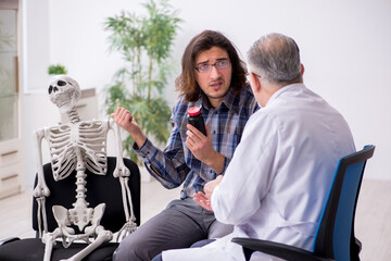 Young male patient visiting experienced doctor psychiatrist
