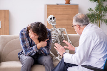 Young male patient visiting experienced doctor psychiatrist